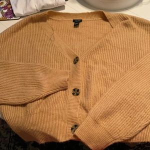 Cropped cardigan sweater.